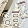 Decorative memo pad with intricate designs on a textured surface